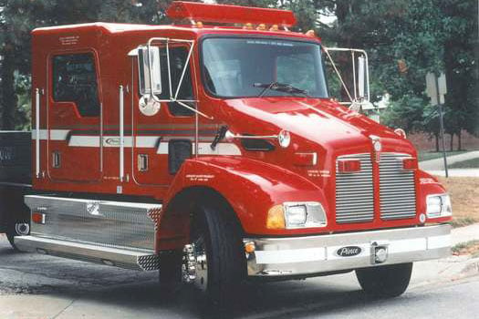 Pierce Manufacturing Contender® Series vehicle parked outside near trees. 