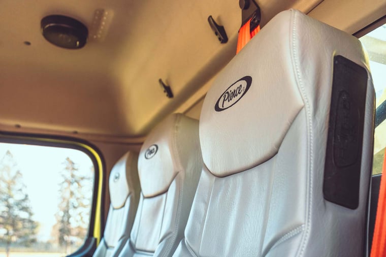 Front vinyl seat on the interior of a Freightliner commercial Chassis. 