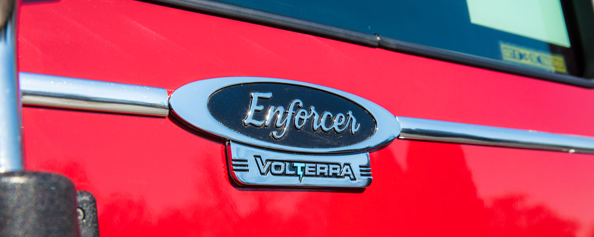 Pierce Enforcer Volterra electric fire truck logo on the side of the fire truck below window. 