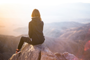 hiking girl sitting on rock 4k 1653333825