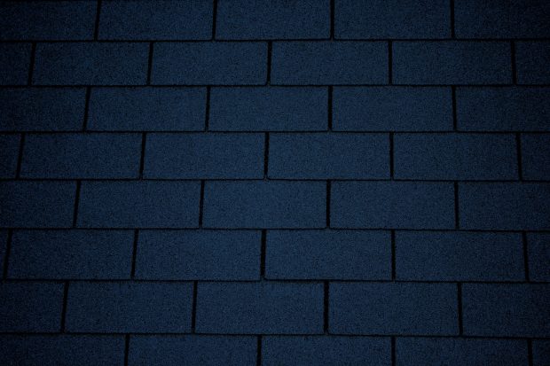 Dark blue wallpaper asphalt roof shingles texture.