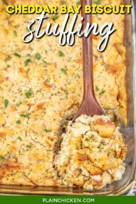 scooping cheddar bay biscuit stuffing/dressing from baking dish with text overlay