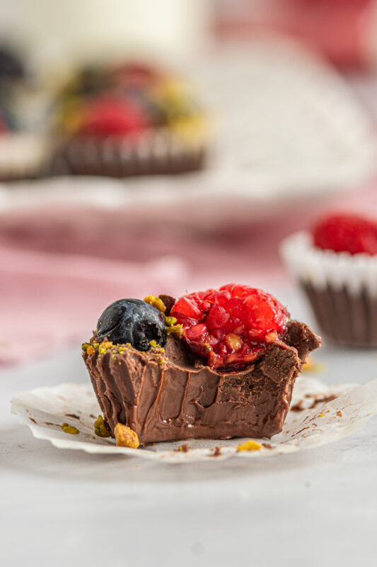 chocolate berry bites with a bite taken out of it