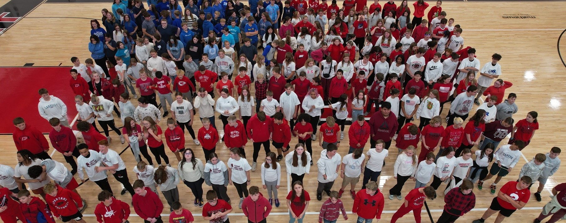 group of students posed to look like an American Flag