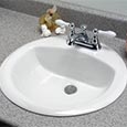 Porcelain drop-in lavatory sink