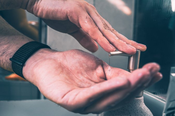 person putting soap on hands