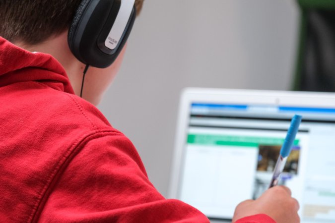 Kid working at a laptop during UK lockdown Best VPNs for school