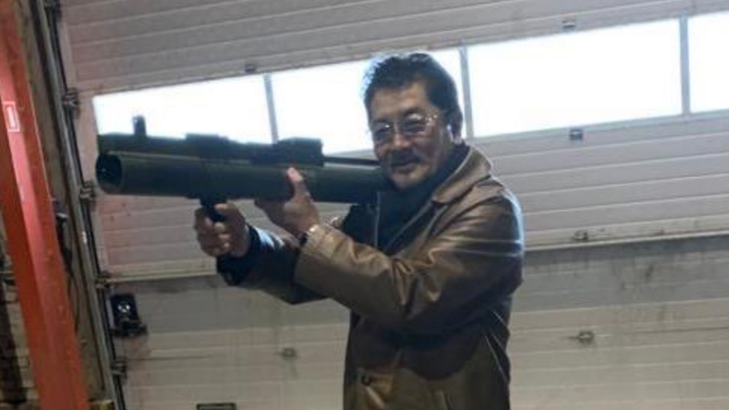 Takeshi Ebisawa holding rocket launcher