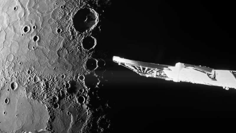 Planet Mercury in the background with its grey, cratered, pockmarked surface. In the foreground are some spacecraft parts