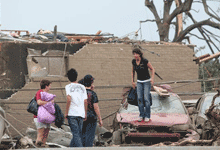 Residents attempt to retrieve their belongings after a tornado destroyed their apartments Wednesday, April 27, 2011 in Tuscaloosa, Ala.  (Caroline Summers/AP)