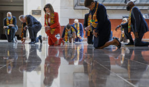 House Speaker Nancy Pelosi of California, center, and other members of Congress, kneel and observe a moment of silence, June 8, on Capitol Hill. Democrats proposed a sweeping overhaul of police oversight and procedures.  (AP Photo/Manuel Balce Ceneta)