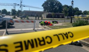 Police tape is seen near the scene of a shooting in Charlotte on early Monday that resulted in two deaths and several more people wounded or injured. (AP Photo/Sarah Blake Morgan)