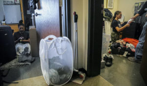 Two Princeton University students pack their rooms after the institution shut down campus in  March. Only some students will be allowed back in the fall and spring. Immigration and Customs Enforcement says that international students taking online-only courses will not be allowed in the country. (AP Photo/Bebeto Matthews)