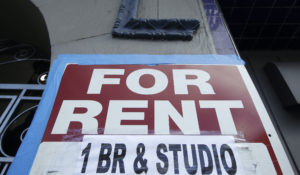 A "For Rent" sign is shown outside of a property in San Francisco. Rent demand is moving from pricey areas and toward neighboring, less expensive areas. (AP Photo/Jeff Chiu)