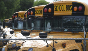 A school bus depot in Broward County, Florida, is quiet as the county continues reopening discussions. (mpi04/MediaPunch /IPX)