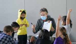 Robert Apple teaches science to students from Public School 11 at the High Line Park Wednesday, Oct. 21, 2020, in New York. (AP Photo/Frank Franklin II)