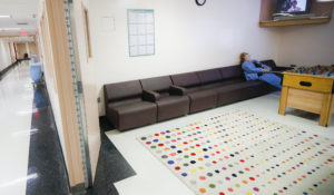 A health care professional takes a break in the employee respite facility at NYC Health + Hospitals Metropolitan, Wednesday, May 27, 2020, in New York.  (AP Photo/John Minchillo)