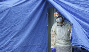 Medical works operate a testing tent at a COVID-19 mobile testing site, Wednesday, Nov. 11, 2020, in the Brooklyn borough of New York. Nearly 4,000 more people tested positive for the virus across the state Monday, another high since the early spring. Over the past seven days New York has reported an average 3,200 new cases per day, up nearly 50% from just a week earlier, with some of the increase being driven in the central and western parts of the state. (AP Photo/John Minchillo)