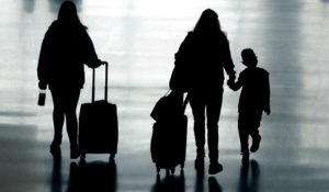 Travelers are shown in Salt Lake City International Airport Tuesday, March 9, 2021, in Salt Lake City.  (AP Photo/Rick Bowmer)