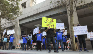 Housing and health care advocates for California's Proposition 21 protest California Gov. Gavin Newsom's ongoing failure on housing and homelessness in downtown Los Angeles on Wednesday, October 21, 2020. (Mark Von Holden/AP Images for AIDS Healthcare Foundation)