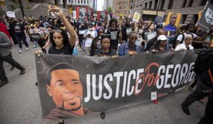 People march for the one year anniversary of George Floyd's death on Sunday, May 23, 2021, in Minneapolis, Minn. (AP Photo/Christian Monterrosa)