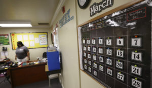 Kristina Washington, special education staff member at Desert Heights Preparatory Academy, surveys her classroom Monday, June 1, 2020, in Phoenix. (AP Photo/Ross D. Franklin)