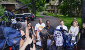 Bill Cosby, center, and spokesperson Andrew Wyatt, right, approach members of the media gathered outside the home of the entertainer in Elkins Park, Pa., Wednesday, June 30,2021. Pennsylvania’s highest court has overturned comedian Bill Cosby’s sex assault conviction. The court said Wednesday, that they found an agreement with a previous prosecutor prevented him from being charged in the case. The 83-year-old Cosby had served more than two years at the state prison near Philadelphia and was released. (AP Photo/Matt Slocum)