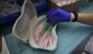 A health worker prepares Pfizer vaccines during the national COVID-19 vaccination campaign in Pamplona, northern Spain, on Sept. 2, 2021. In a statement Monday Sept. 6, 2021, the European Medicines Agency says it has started an expedited evaluation on whether to recommend a booster dose of the coronavirus vaccine made by Pfizer-BioNTech. (AP Photo/Alvaro Barrientos, File)