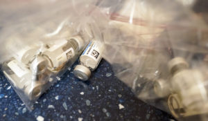 Empty vials of the Johnson & Johnson's one-dose COVID-19 vaccine are seen at the Vaxmobile, at the Uniondale Hempstead Senior Center, Wednesday, March 31, 2021, in Uniondale, N.Y.  (AP Photo/Mary Altaffer)