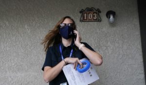 Pima County Constable Kristen Randall arrives at an apartment complex to speak to a rental resident about their eviction case Friday, Sept. 24, 2021, in Tucson, Ariz. (AP Photo/Ross D. Franklin)