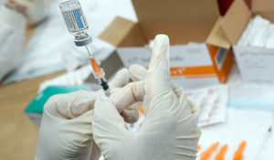 A registered nurse fills a syringe with the Johnson & Johnson COVID-19 vaccine at a pop up vaccination site in the Staten Island borough of New York, April 8. 2021. (AP Photo/Mary Altaffer, File)