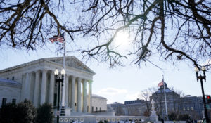 The Supreme Court shown Friday, Jan. 7, 2022, in Washington. The Supreme Court is taking up two major Biden administration efforts to bump up the nation's vaccination rate against COVID-19 at a time of spiking coronavirus cases because of the omicron variant. (AP Photo/Evan Vucci)