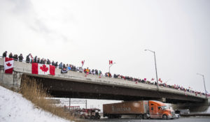 Protesters show support for the Freedom Convoy of truck drivers who were making their way to Ottawa to protest against COVID-19 vaccine mandates by the Canadian government on Thursday, Jan. 27, 2022, in Vaughan. (Photo by Arthur Mola/Invision/AP)