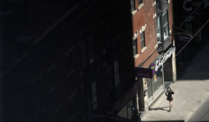 A masked pedestrian walks through downtown Toronto, Friday, Sept. 10, 2021. (AP Photo/Chris Pizzello)