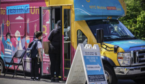 A mobile COVID-19 testing van open for walk-in clients in the Brooklyn borough of New York. (AP Photo/Bebeto Matthews)