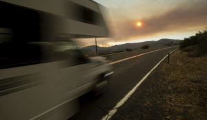 A recreational vehicle drives out of Yosemite Valley in Yosemite National Park, Calif., on Tuesday, July 24, 2018. (AP Photo/Noah Berger)