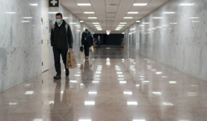 A near-empty corridor is seen in the Dirksen Senate Office Building, part of the U.S. Capitol complex, after an unprecedented number of cases in the Capitol community affecting hundreds of individuals, according to the Capitol physician, in Washington, Tuesday, Jan. 4, 2022. (AP Photo/J. Scott Applewhite)