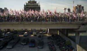 Tens of thousands of demonstrators, many of them unemployed or with precarious jobs, marched demanding formal and better paid employment and against that deal with the International Monetary Fund in Buenos Aires, Argentina, on Thursday, June 9, 2022. (AP Photo/Victor R. Caivano)