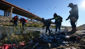 Migrants walk toward the US-Mexico border in Ciudad Juárez, Mexico, on Wednesday. (AP Photo/Christian Chavez)