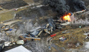 This photo taken with a drone shows portions of a Norfolk Southern freight train that derailed Friday night in East Palestine, Ohio are still on fire at mid-day Saturday, Feb. 4, 2023. (AP Photo/Gene J. Puskar)