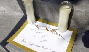 A note left by someone at the Spectrum News 13 TV station is seen at a makeshift memorial in front of the emergency room at Orlando Regional Medical Center Thursday, Feb. 23, 2023, in Orlando, Fla. (AP Photo/John Raoux)