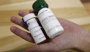 Bottles of abortion pills mifepristone, left, and misoprostol, right, at a clinic in Des Moines, Iowa, Sept. 22, 2010. (AP Photo/Charlie Neibergall, File)