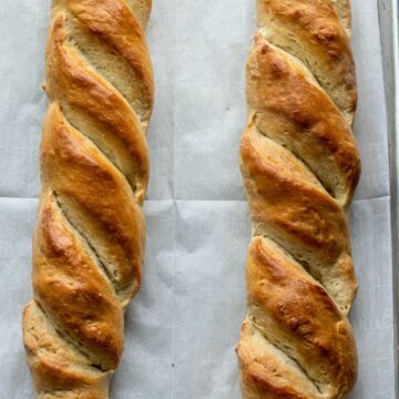 French bread loaves on large baking sheet