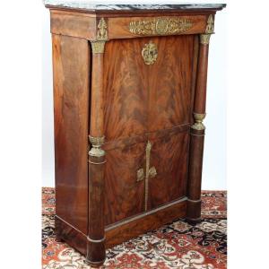 Secretaire in mogano con finitura in bronzo dorato, marmo in grigio venato. Impero XIX sec.