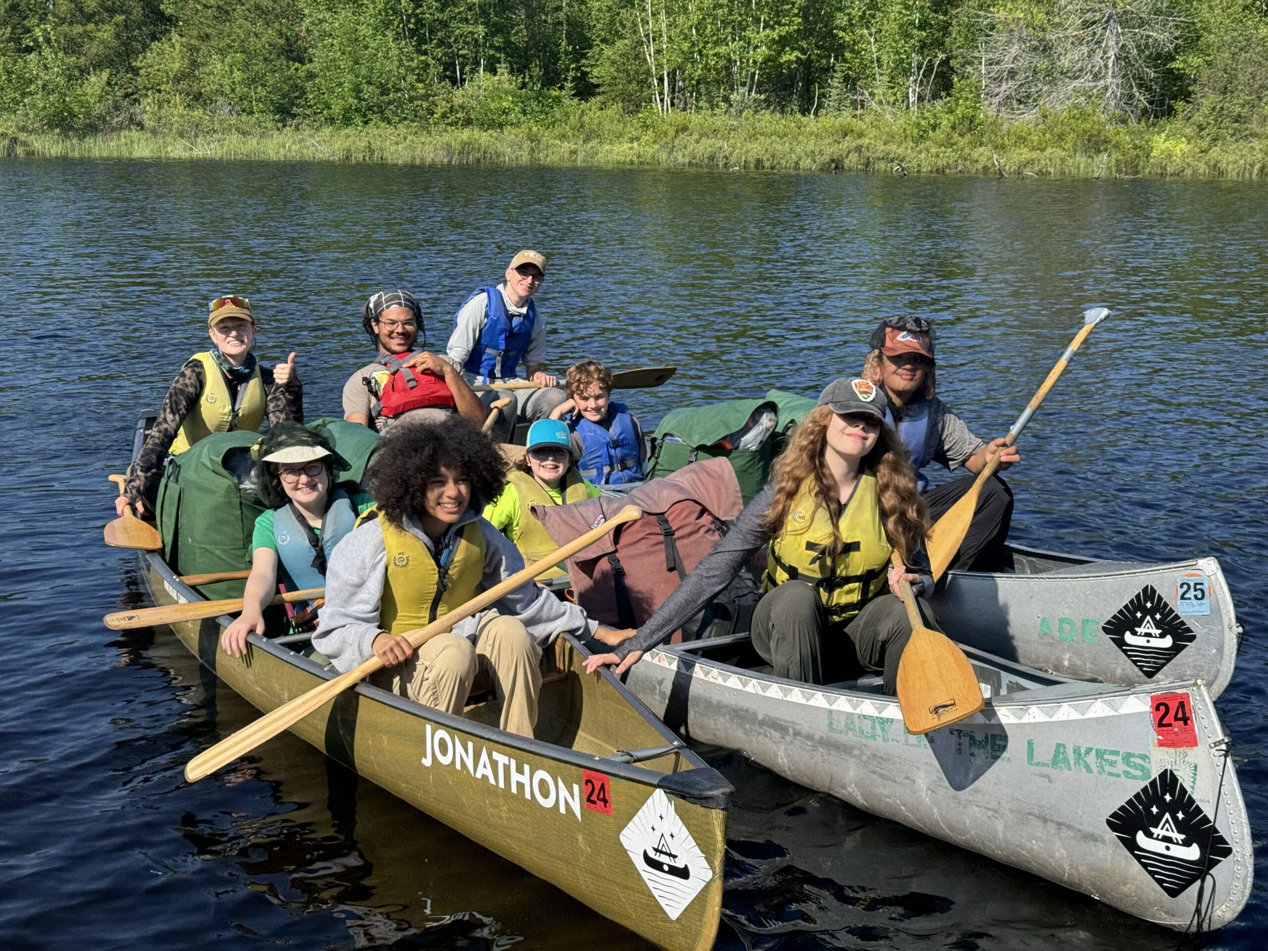 A group of students in canoes.