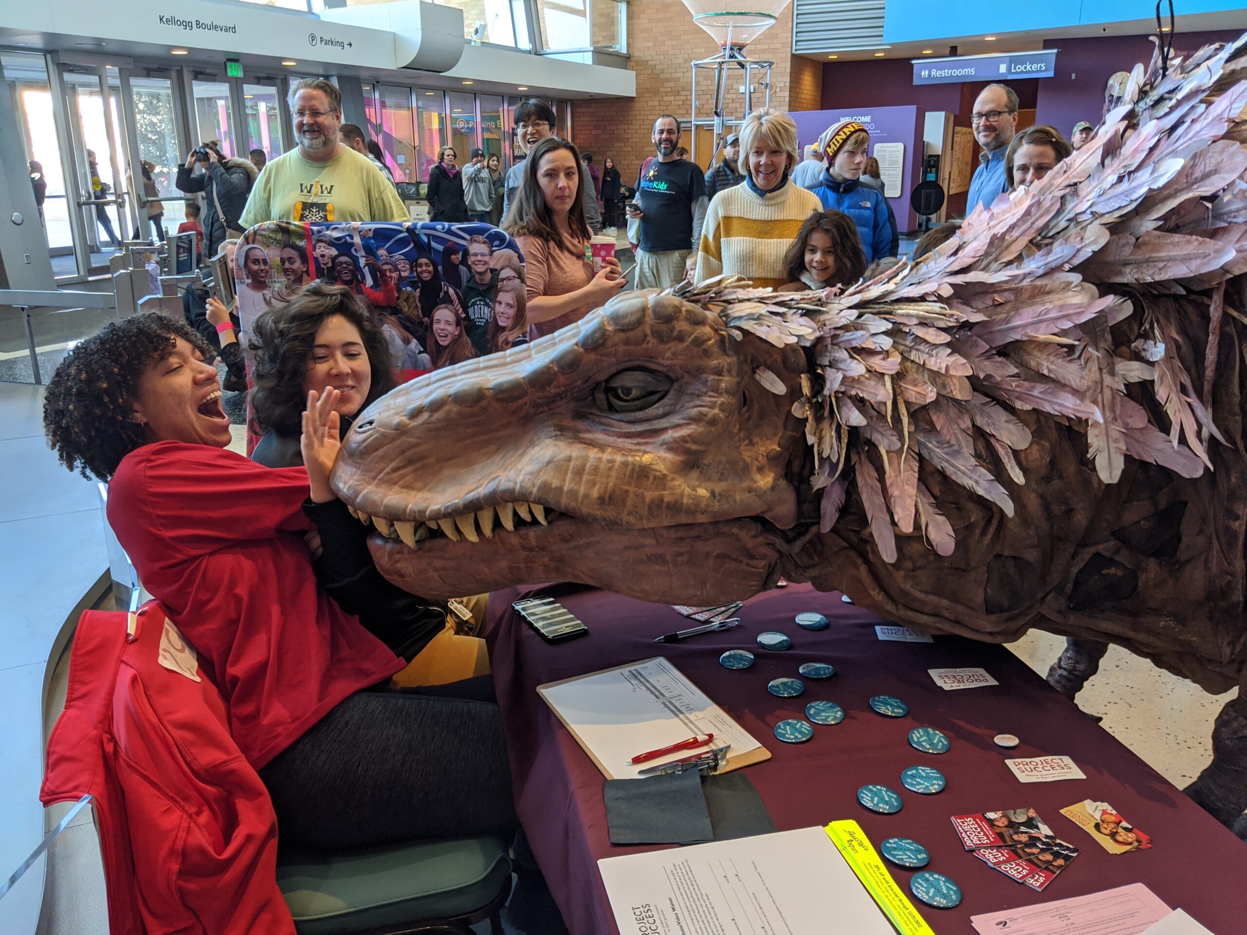 PS employee with arm inside of Trex Puppet