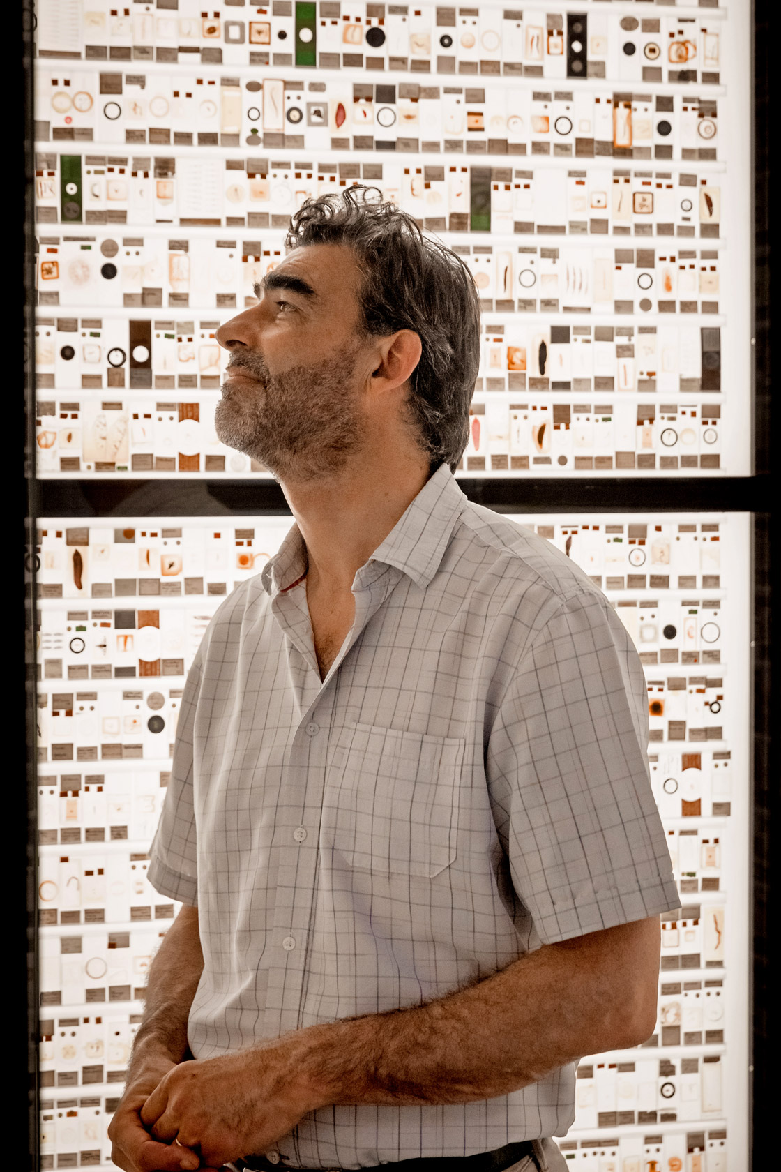 Nick Lane inspects slide samples at the Grant Museum of Zoology in London, England.