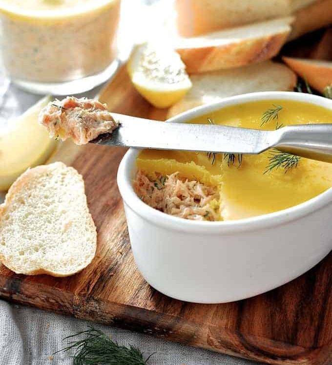 Elegant Smoked Trout Dip in a small white dish with bread on the side.