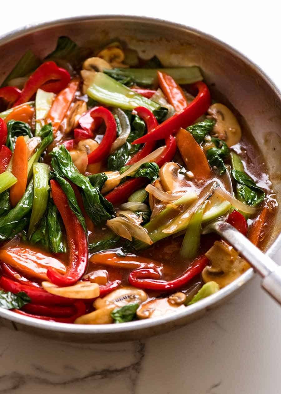 Skillet with sauce stir fried vegetables, fresh off the stove