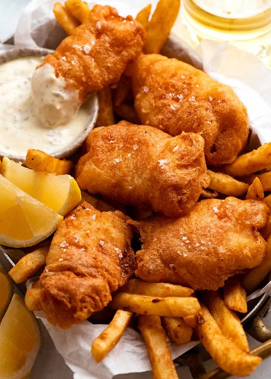 Beer Battered Fish and Chips in a basket with tartare sauce